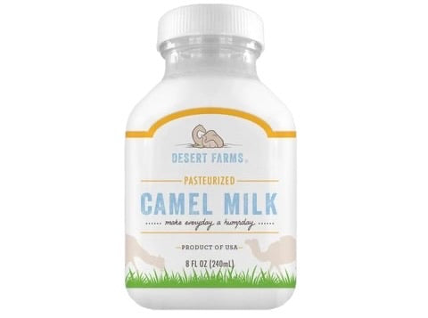 Bottle of Desert Farms camel milk on a white background