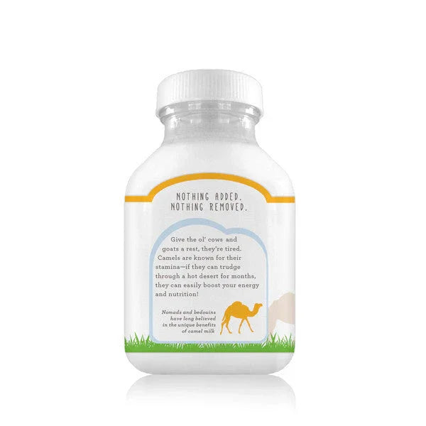 Bottle of back side Desert Farms camel milk on a white background